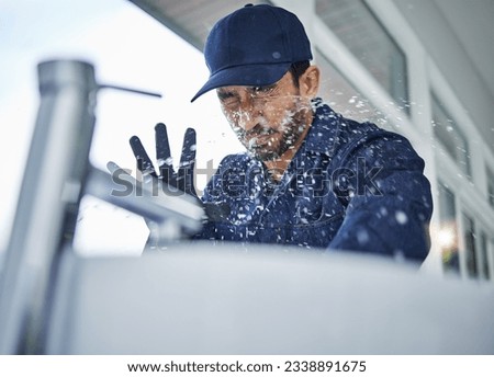 Plumbing, accident and asian man in bathroom with water splash, crisis or hand basin leak, fail or crisis. Faucet, emergency and male plumber with mistake, problem and pipe flood in home repairs Royalty-Free Stock Photo #2338891675