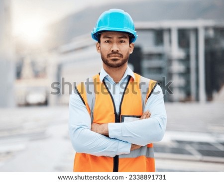 Portrait, construction worker and man with arms crossed with solar panel maintenance outdoor. Roof, eco engineer and green energy project with builder and sustainability contractor ready for work Royalty-Free Stock Photo #2338891731