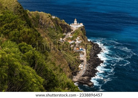 A panoramic view of the Nordeste lighthouse directly on the cliffs of the Azores island of Sao Miguel, Portugal Royalty-Free Stock Photo #2338896457