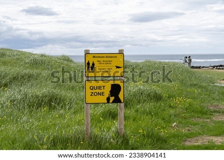 Signs reminding tourists to keep distance between them and the golden seals and of the quiet zone at Ytri Tunga beach in Iceland