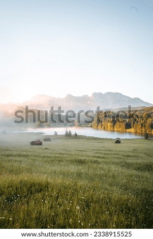 Amazing foggy Sunrise at Geroldsee, also Wagenbruchsee, Bavaria, Germany Europe Royalty-Free Stock Photo #2338915525