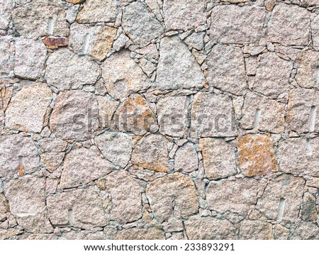 path of pink granite and coarse rough seams of cement