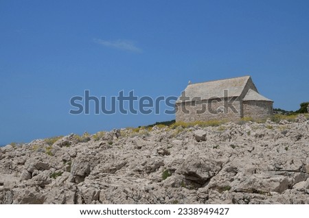 Small church on the rocks of the Adriatic coast in Croatia