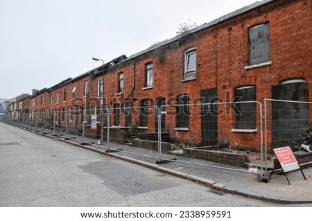 Derelict terraced houses ready to be demolished to make way for new homes Royalty-Free Stock Photo #2338959591