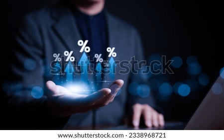 Businessman hand with rising arrow and percentage icon. Interest rate and dividend concept, Business finance and money concept, Investment growth, Return on stocks and mutual funds, profitability,