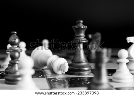Chess photographed on a chessboard Royalty-Free Stock Photo #233897398