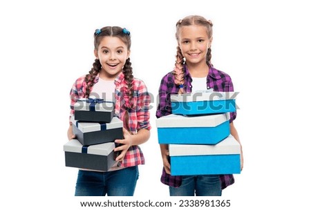 children girls sharing present or gift box to friend from shopping
