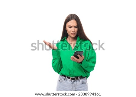 well-groomed bright young brown-haired female model with brown eyes in a green shirt posing on a white background with copy space