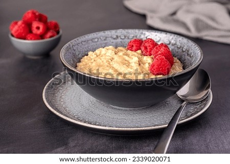 Food photography of oatmeal, porridge, raspberry, fibre, ripe, vegan, wholegrain, lifestyle, dish, berry, homemade Royalty-Free Stock Photo #2339020071