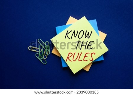 Know the rules symbol. Yellow steaky note with words Know the rules. Beautiful deep blue background. Business and Know the rules concept. Copy space. Concept word