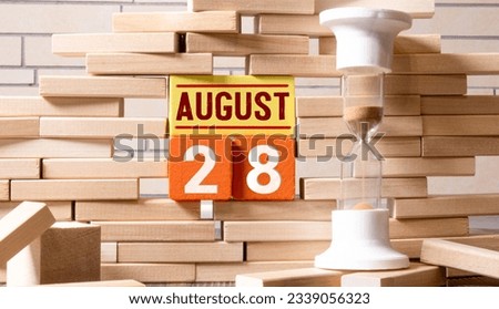 Vintage photo, August 28th. Date of 28 August on wooden cube calendar, copy space for text on board.