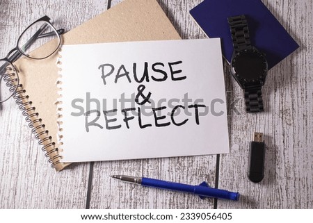 Blackboard written pause reflect with alarm clock. Pause and reflect word with time on chalkboard background. Royalty-Free Stock Photo #2339056405