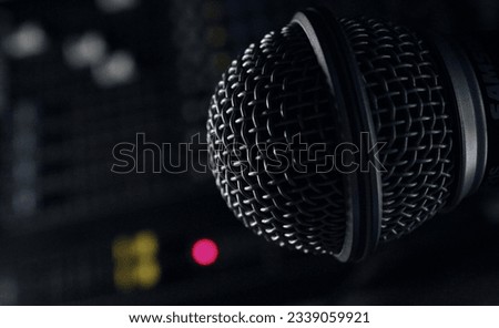 microphone in recording studio and mixing desk