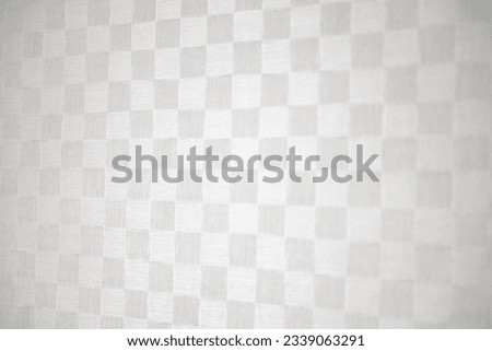 White and gray checkered background.