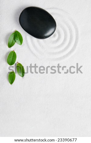 Zen garden background with copy space for your text. Pebble and leaf for relax and meditation.