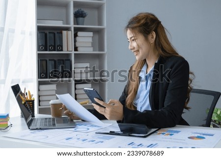 Asian businesswoman working with analysis data sitting at desk in office workplace, business finance and accounting, business online training concept.