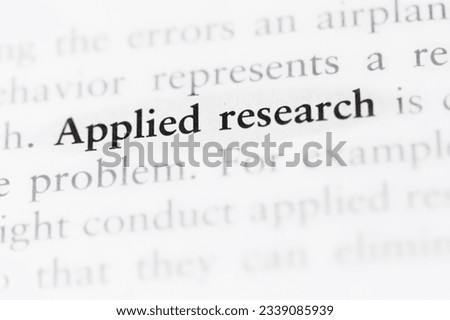term applied research printed in textbook focused in closeup of explanation