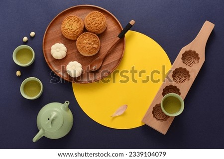 Background of Chinese Traditional Festival Mid-Autumn Festival.The Chinese meaning on the mooncake in the picture is: high-quality five kernels, milk flavored grapes, chestnuts, three flavors.