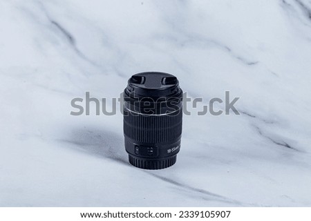 Camera lens in high res. image and isolated with a blurry ends
