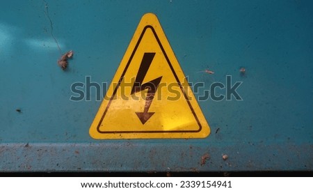 High Voltage Hazard Sign: This sign is usually a triangular shape with a yellow background, a black border, and an image of the high voltage symbol in the center. The symbol usually displays a thunder