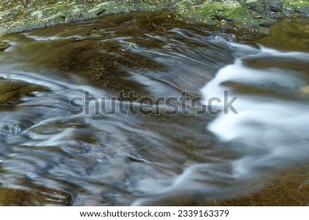 Scenery of cool flow of mountain stream at Akame 48 Waterfalls