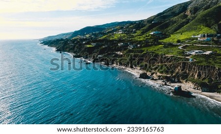 Matador beach and beautiful landscape with rocks and ocean against blue sky, California. An aerial shot of El Matador Beach in Malibu, California Royalty-Free Stock Photo #2339165763