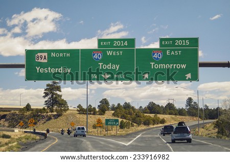 Freeway sign on western US highway New Year's concept yesterday today tomorrow as destinations exits for old and new year Easy update News MT Gothic Bold or Helvetica editable years to 2022 2023