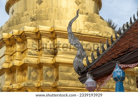 Wat Phrathat Chom Thong, is Buddhist Temple located on the mountain named Chom Thong, Phayao, Th which is the Lanna-styled chedi with its height of 30 metres is situated on the three-layer square base Royalty-Free Stock Photo #2339193929
