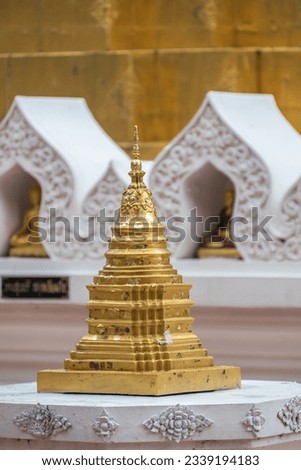 Wat Phrathat Chom Thong, is Buddhist Temple located on the mountain named Chom Thong, Phayao, Th which is the Lanna-styled chedi with its height of 30 metres is situated on the three-layer square base Royalty-Free Stock Photo #2339194183