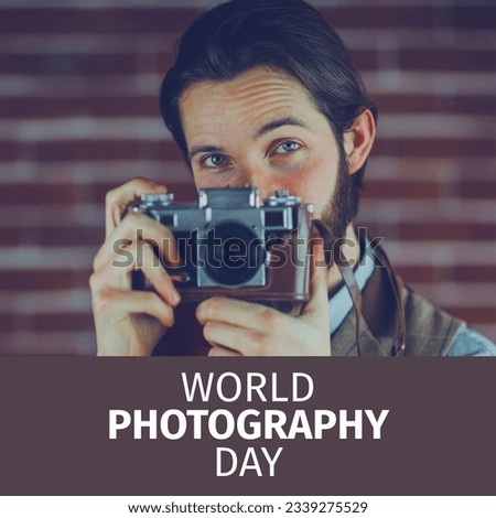World photography day text in white on brown over happy caucasian man using retro camera. Global celebration of photography campaign, digitally generated image.