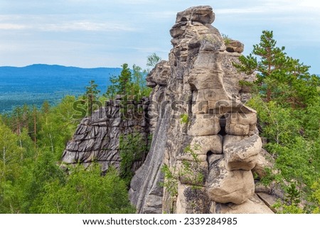 Magnificent rocks of the Arakul shikhan in the Chelyabinsk region on a summer day Royalty-Free Stock Photo #2339284985