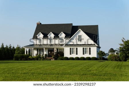 Beautiful white farm house with black roof near Milford, Delaware, U.S.A Royalty-Free Stock Photo #2339298237