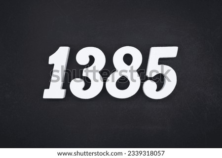Black for the background. The number 1385 is made of white painted wood.