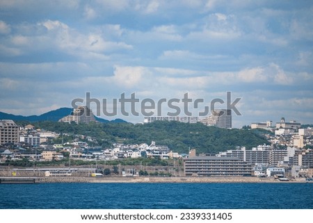 The cityscape of Tarumi-ku, Kobe, Japan, as seen from the ferry.