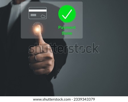 payment done Businessman paying for goods with credit card security fingerprint scan To pay for online shopping on the Internet on the virtual window