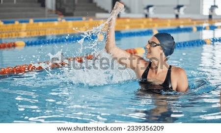 Swimming, success or happy winner in celebration for achievement in race or pool competition. Fitness, wellness or excited woman swimmer winning sports game with victory or championship performance Royalty-Free Stock Photo #2339356209