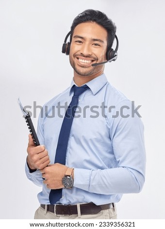 Call center, portrait and Asian man with documents for telemarketing, crm support and consulting isolated on a white studio background. Face, smile and sales agent with paperwork for customer service Royalty-Free Stock Photo #2339356321