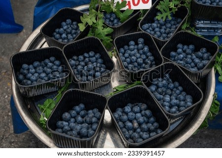 Blueberry sale in the traditional farm Turkish market, a counter filled with fresh fruits