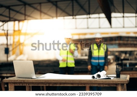 Engineering people on background. Safety Hard hat helmet, laptop computer and blue print paper plan. Construction Worker Planning Contractor
