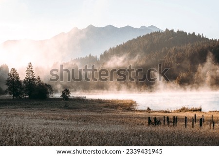 Amazing foggy Sunrise at Geroldsee, also Wagenbruchsee, Bavaria, Germany Europe Royalty-Free Stock Photo #2339431945