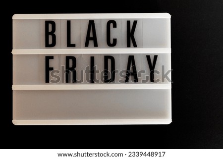 poster with letters for Black Friday day with a black background

