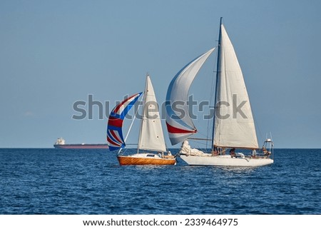 Sailing yacht regatta. Many sailing yachts in a row. sailing yachts under gennaker, speaker, genoa Royalty-Free Stock Photo #2339464975