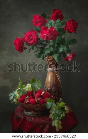 Still life with bouquet of red roses and fruits