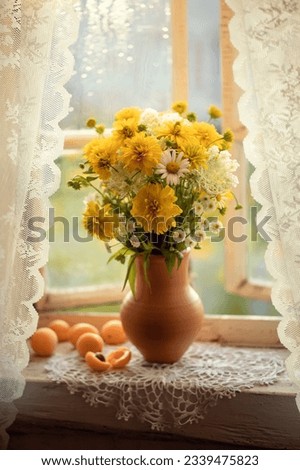 Still-life. Photo of a bouquet of flowers on the window.