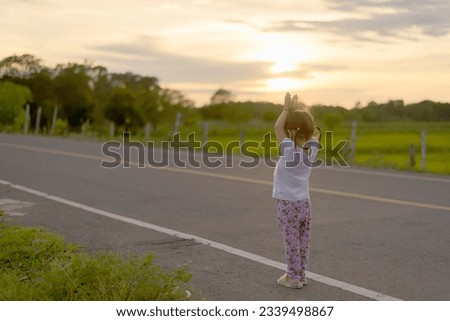 Praise the lord-Woman worshipping god at sunset.