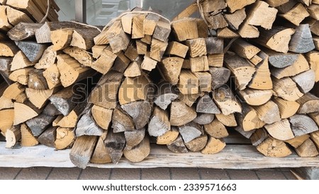 Woodstack or woodfire for camping in summer or for heat in winter. Royalty-Free Stock Photo #2339571663