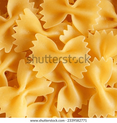 Italian Farfalle pasta spilled, macro photo