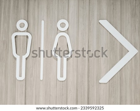 Male and female signboard with direction arrows