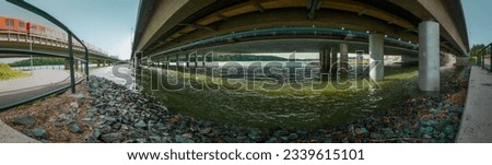 Main road overpass bridge and orange subway. A great panoramic landscape of massive concrete architecture. A powerful photo from under the bridges.
A colorful mood picture in a large size.