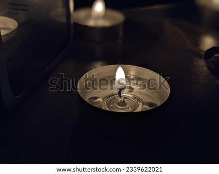 small candle in the darkness